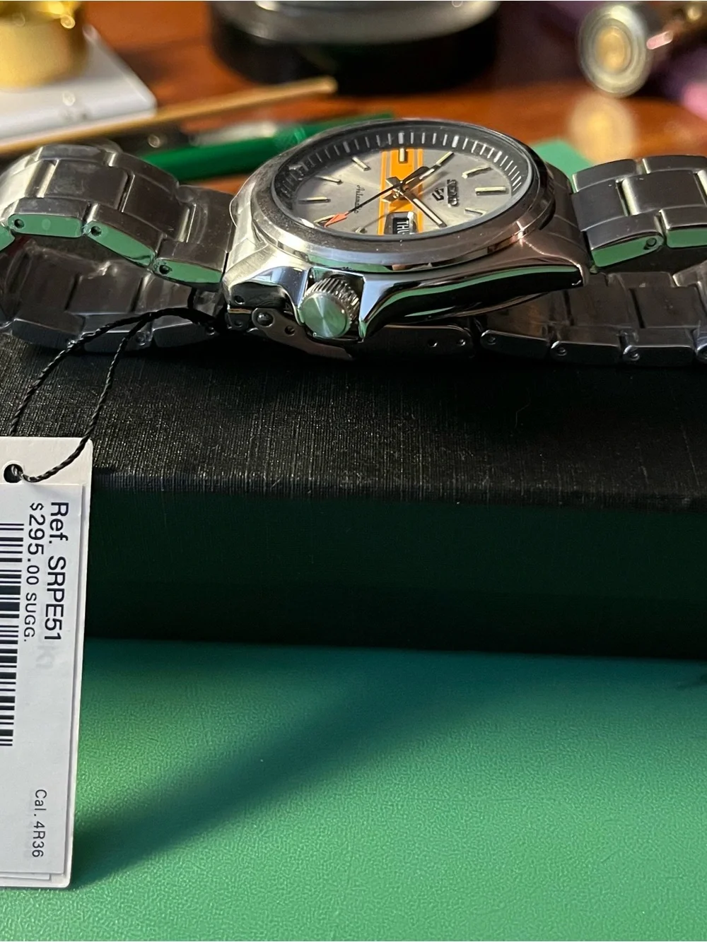 Seiko : Retro GT dial. Silver Dial Watch with Orange Stripe Accent SRPE55